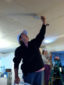 Linda (the homeowner) learning to mud drywall