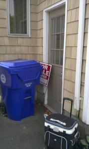 Sharon's "for sale" sign in the trash